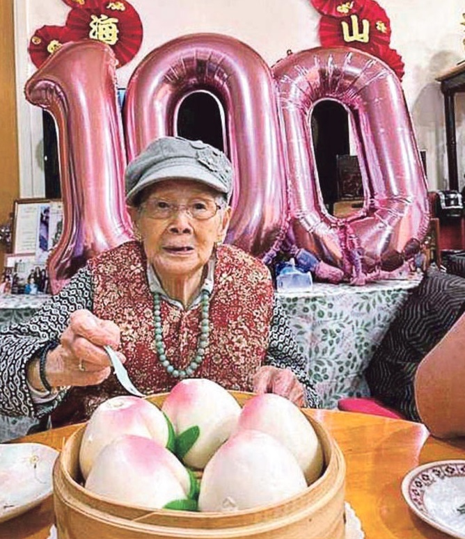 覃美金