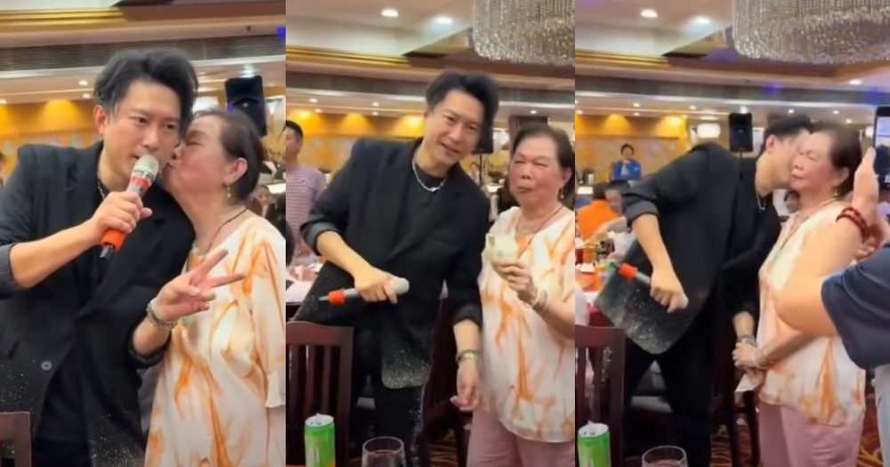 男歌手被阿婆塞钱要求献吻(视频截图)